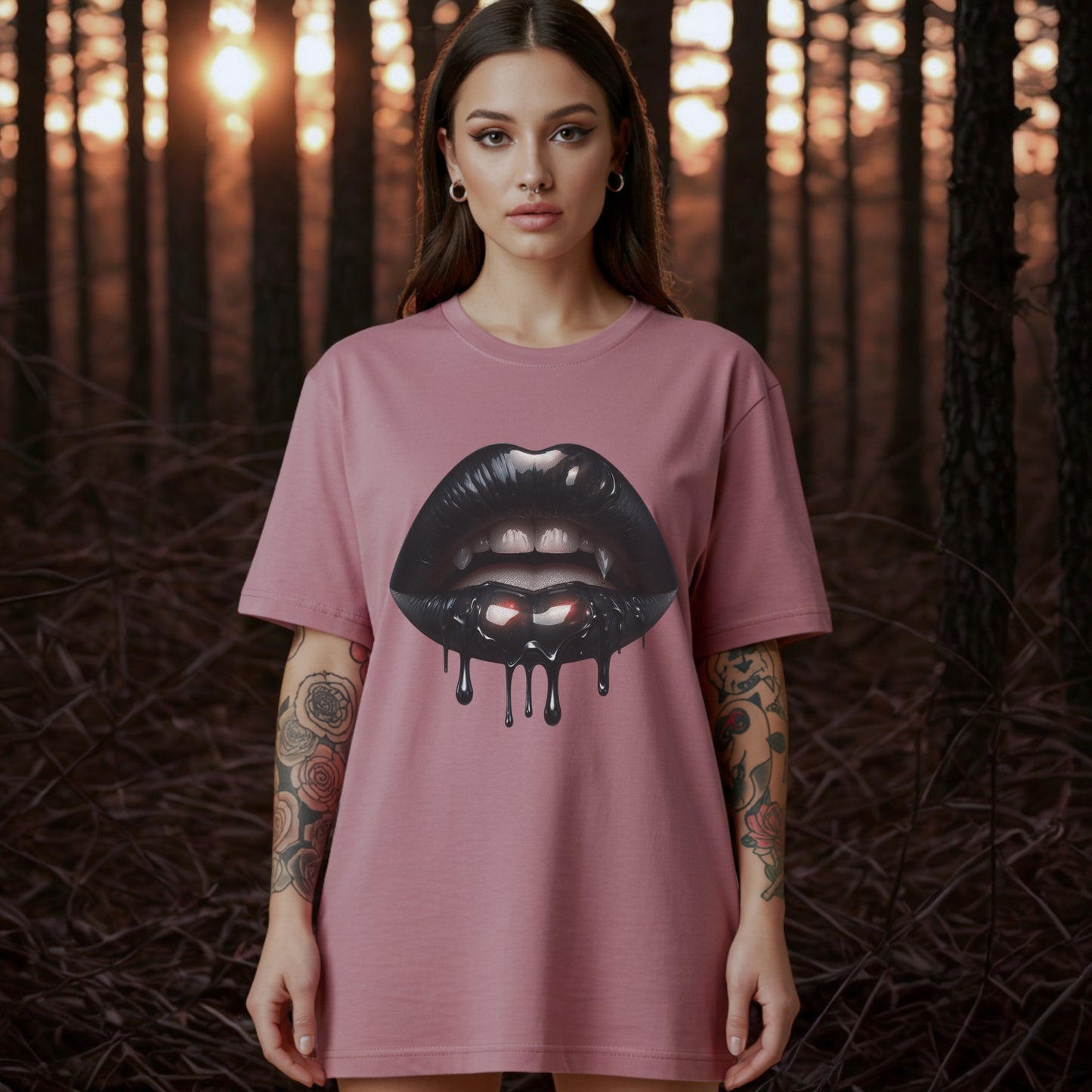Woman wearing a pink t-shirt with a graphic design of black lips on a forest background