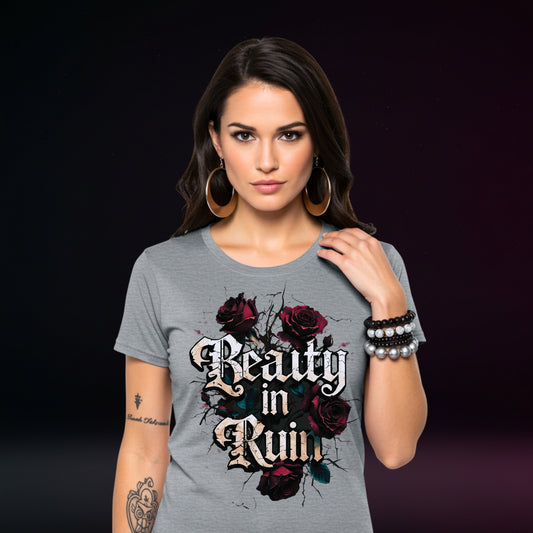 Woman wearing a gray t-shirt with floral design and text on a dark background