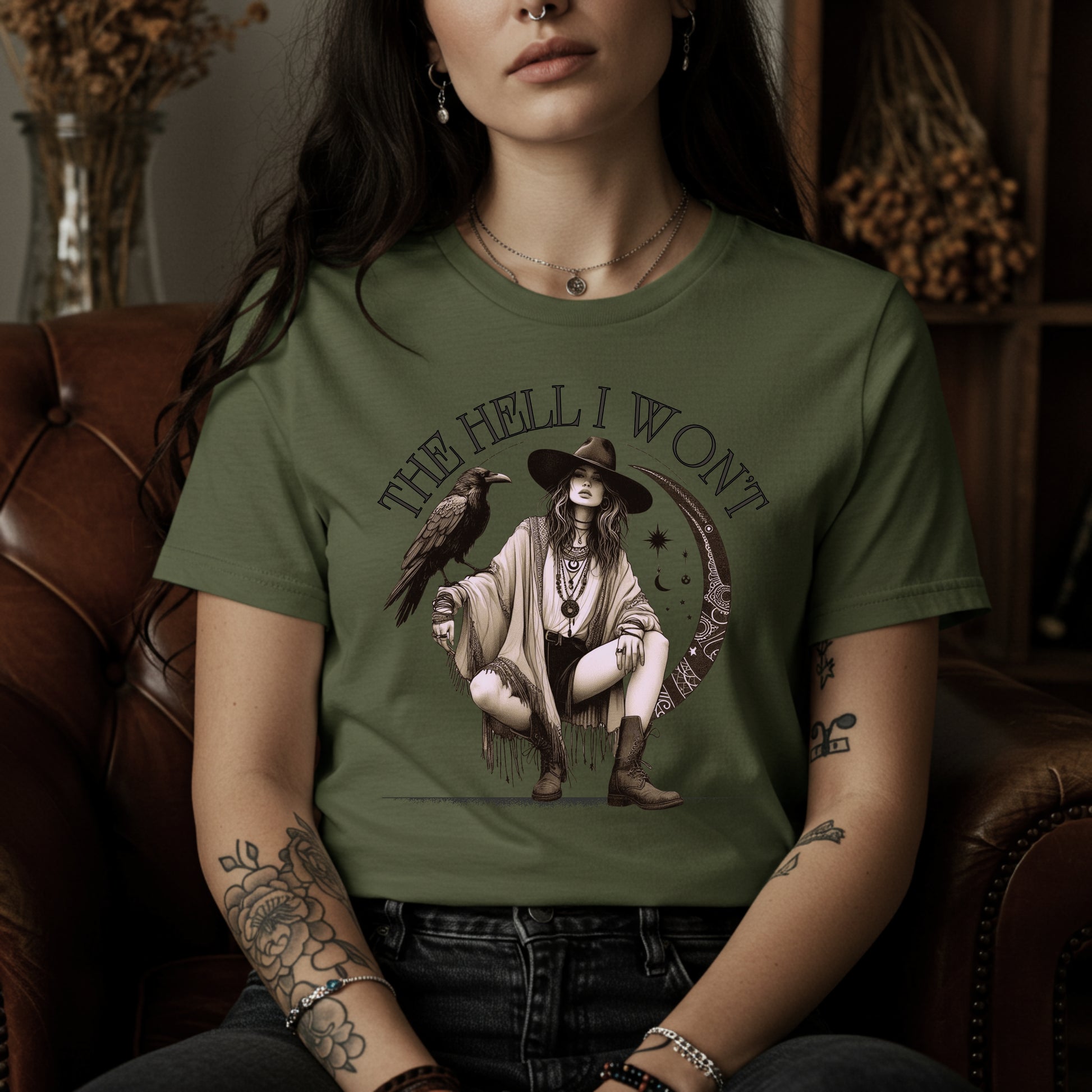 Person wearing a green t-shirt with a graphic design and text, sitting on a brown leather couch.