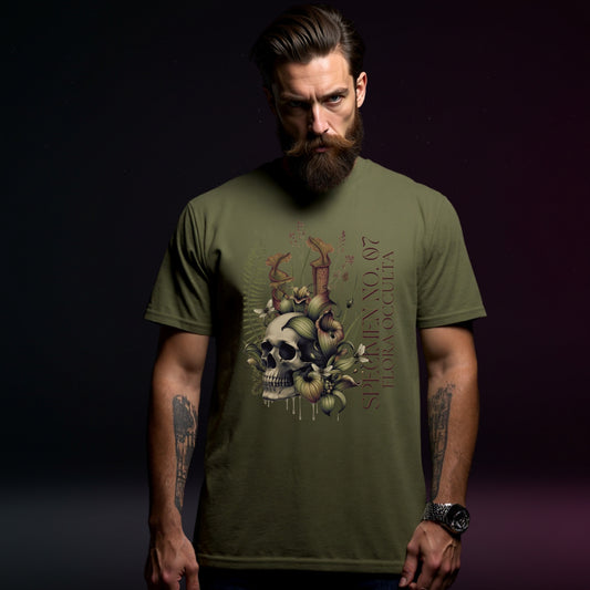 Man wearing a green t-shirt with a skull and floral design on a dark background
