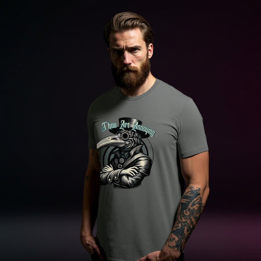 Man wearing a gray t-shirt with a graphic design on a dark background