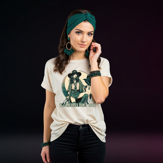 Woman wearing a white t-shirt with a graphic design and text, standing against a dark background