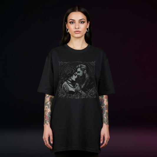 Person wearing a black t-shirt with a graphic design on a dark background