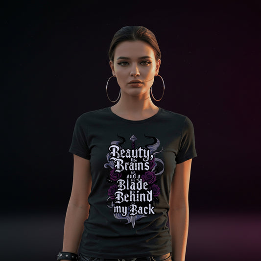Person wearing a black t-shirt with gothic text design on a dark background